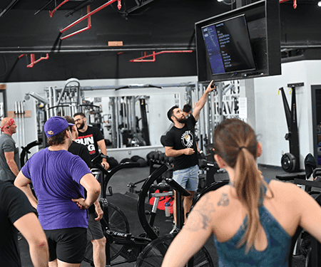 Coach guiding a class at Man O' War Fitness, Lexington KY.